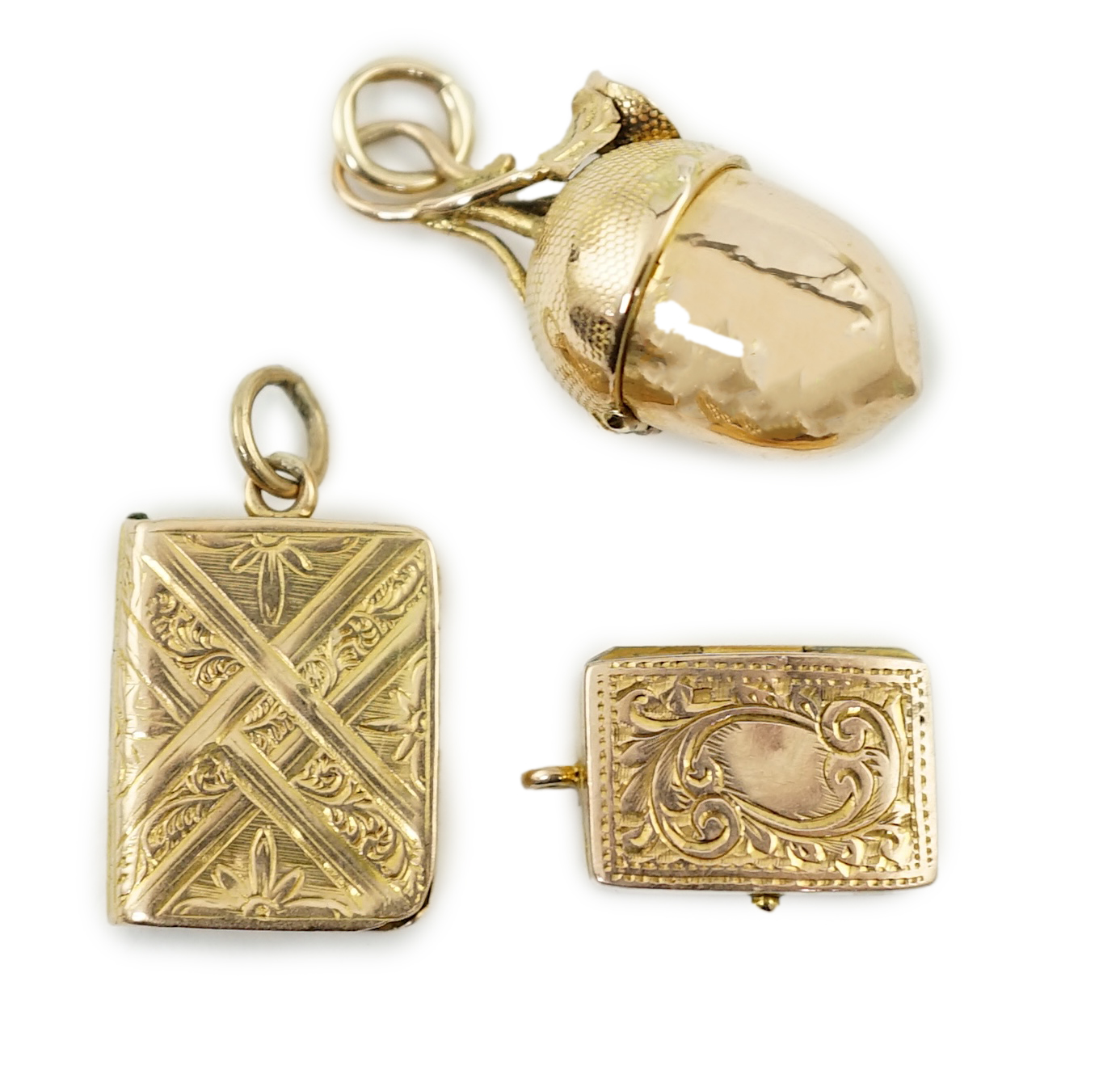 Three small gold vinaigrette charms